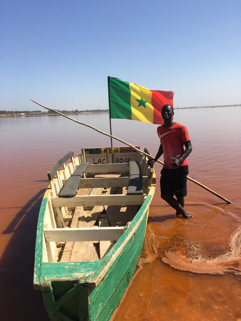 Pirogue boat captain at Lac Rose