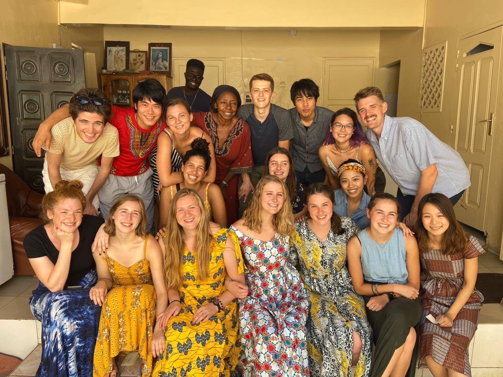 A festive feast at Prof. Honorine's (reddish dress) house!